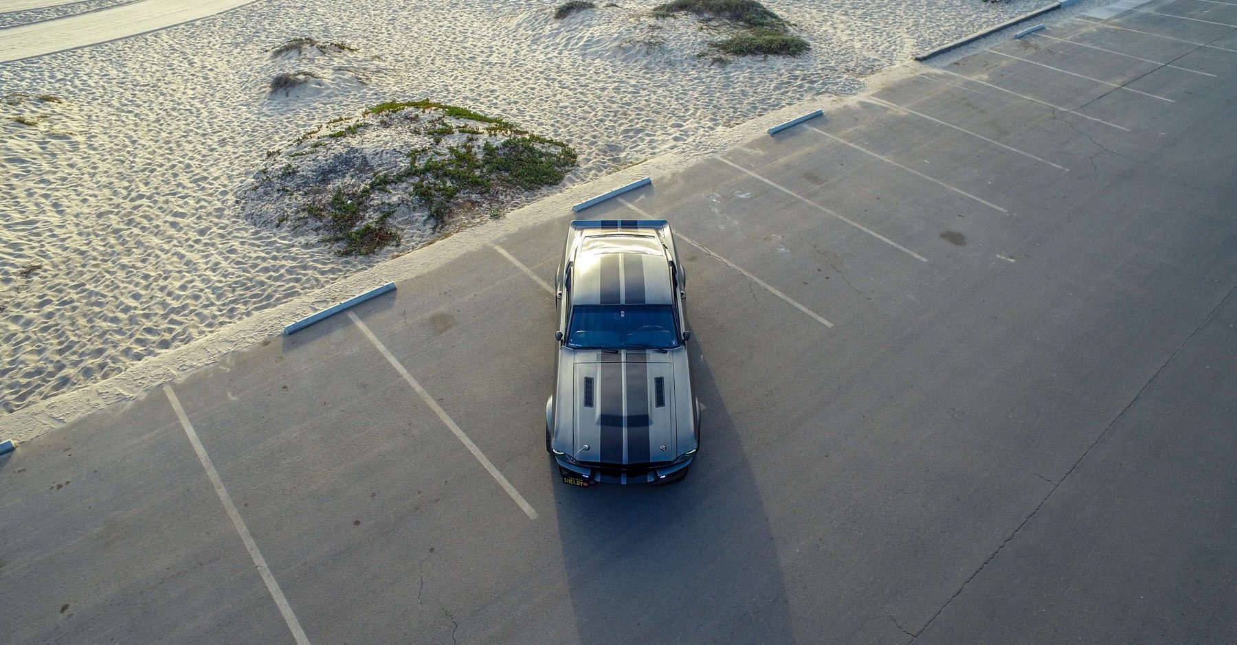 MAGStang GT500R parked on a coastal overlook at dusk