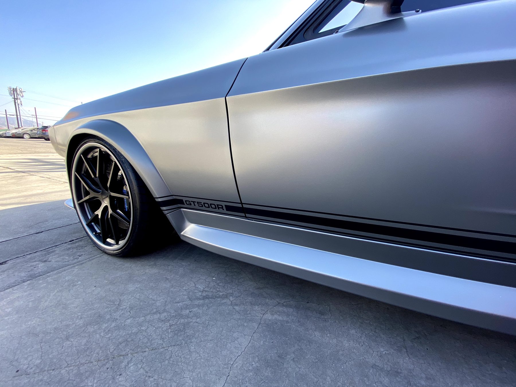 Stripped modern chassis prepared for MAGStang conversion