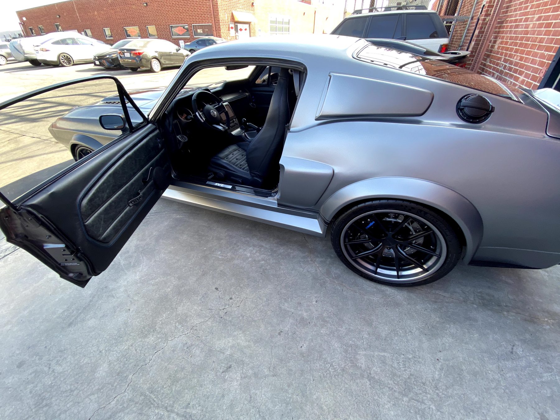 Carbon MAGStang body in primer during panel fitment